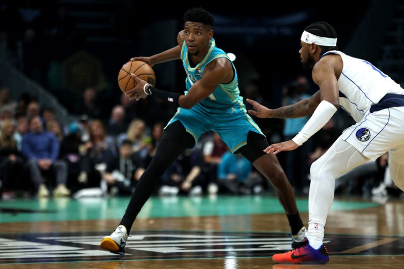 CHARLOTTE, NORTH CAROLINA - APRIL 09: Brandon Miller #24 of the Charlotte Hornets controls the ball during the first half of an NBA game against the Dallas Mavericks at Spectrum Center on April 09, 2024 in Charlotte, North Carolina. NOTE TO USER: User expressly acknowledges and agrees that, by downloading and or using this photograph, User is consenting to the terms and conditions of the Getty Images License Agreement. (Photo by David Jensen/Getty Images)