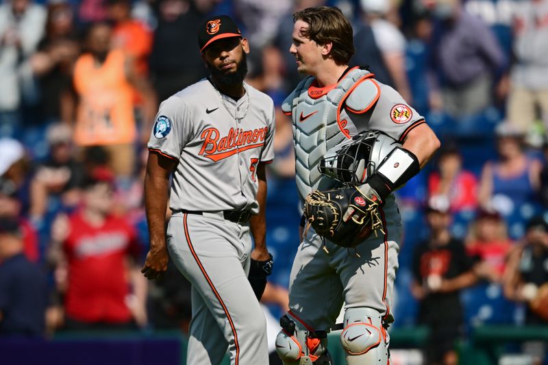 Aug 4, 2024; Cleveland, Ohio, USA; Baltimore Orioles relief pitcher Seranthony Dominguez (56) is congratulated by catcher Adley Rutschman (35) after defeating the Cleveland Guardians at Progressive Field. Mandatory Credit: David Dermer-USA TODAY Sports