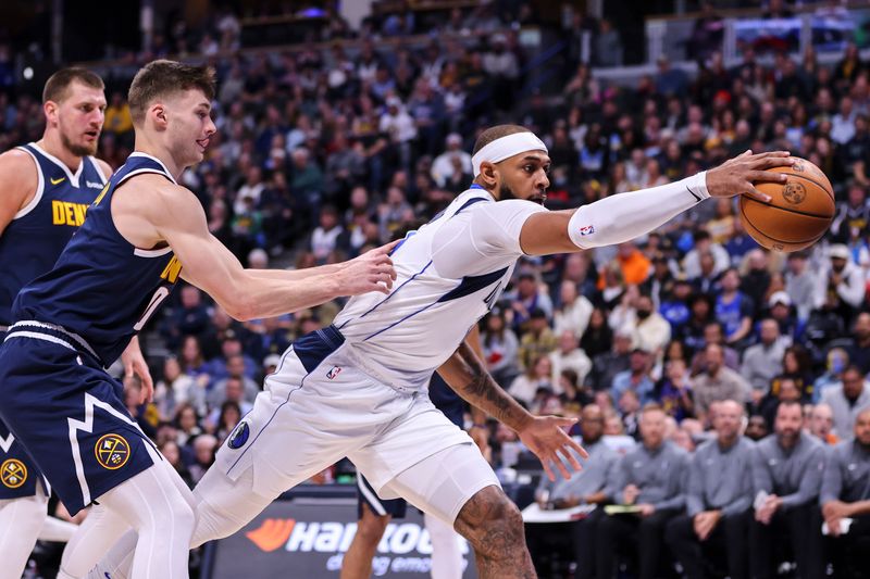 DENVER, COLORADO - NOVEMBER 10: Daniel Gafford #21 of the Dallas Mavericks saves the ball from going out of bounds in the first half against the Denver Nuggets at Ball Arena on November 10, 2024 in Denver, Colorado. NOTE TO USER: User expressly acknowledges and agrees that, by downloading and or using this photograph, user is consenting to the terms and conditions of the Getty Images License Agreement. (Photo by Tyler Schank/Clarkson Creative/Getty Images)