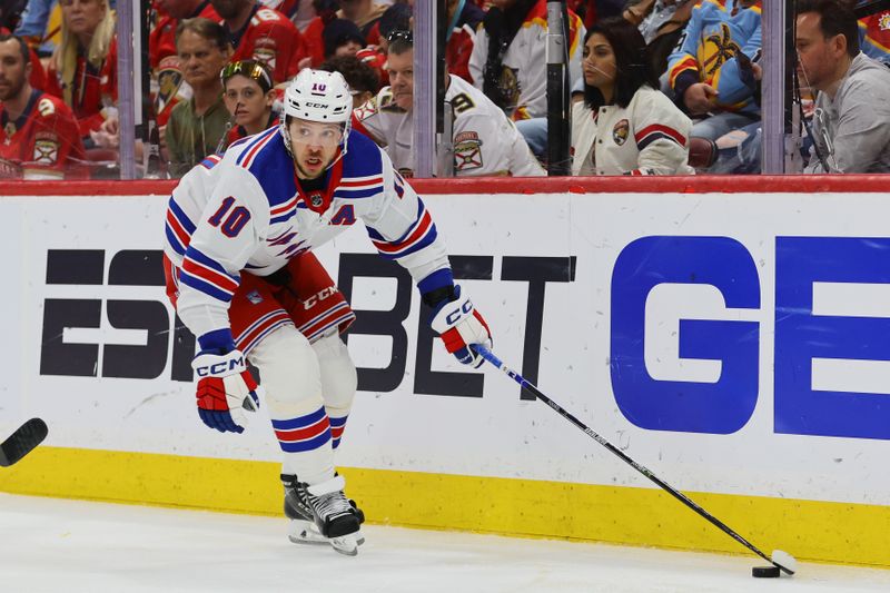 May 26, 2024; Sunrise, Florida, USA; New York Rangers left wing Artemi Panarin (10) moves the puck against the Florida Panthers during the second period in game three of the Eastern Conference Final of the 2024 Stanley Cup Playoffs at Amerant Bank Arena. Mandatory Credit: Sam Navarro-USA TODAY Sports