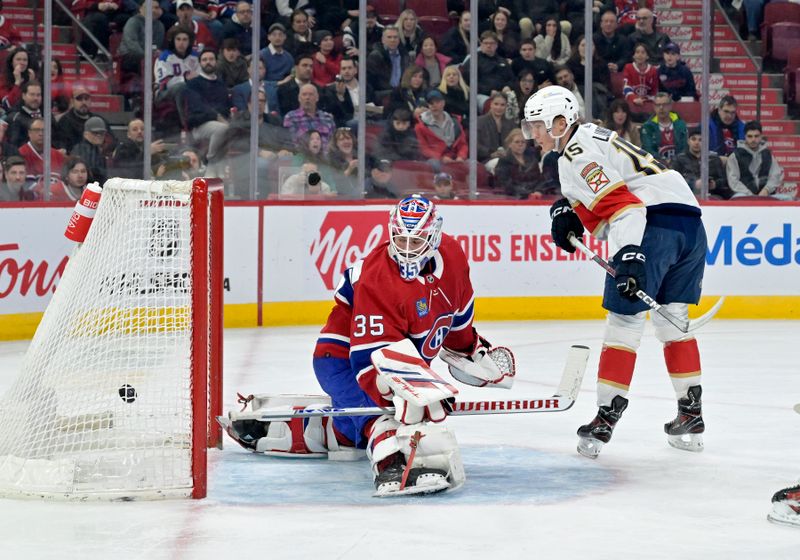 Apr 2, 2024; Montreal, Quebec, CAN; Florida Panthers forward Anton Lundell (15) scores a goal against Montreal Canadiens goalie Sam Montembeault (35) during the first period at the Bell Centre. Mandatory Credit: Eric Bolte-USA TODAY Sports