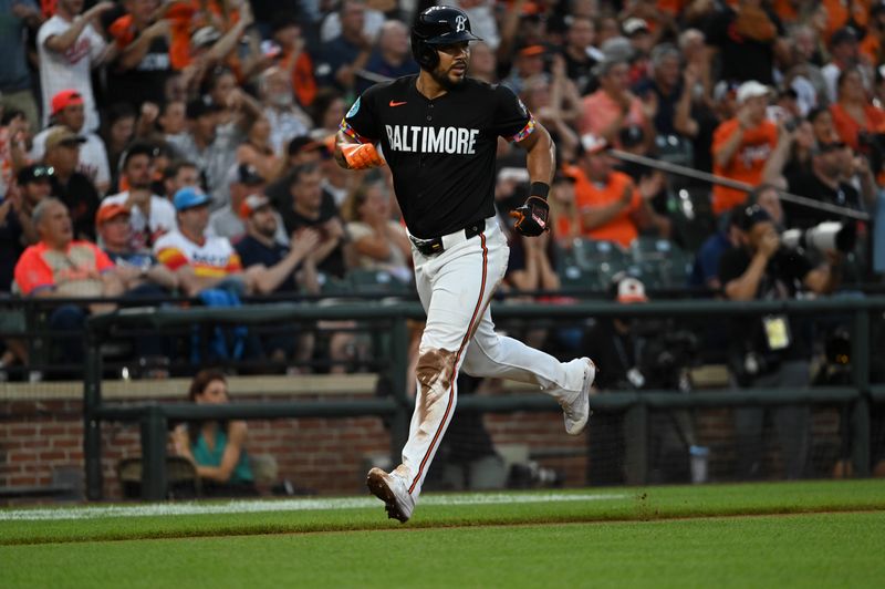 Aug 23, 2024; Baltimore, Maryland, USA;  Baltimore Orioles right fielder Anthony Santander (25) scores during the second inning against the Houston Astros at Oriole Park at Camden Yards. Mandatory Credit: Tommy Gilligan-USA TODAY Sports