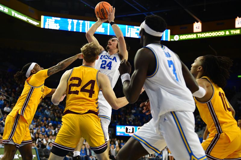 Mar 2, 2023; Los Angeles, California, USA; UCLA Bruins guard Jaime Jaquez Jr. (24) shoots against Arizona State Sun Devils guard DJ Horne (0) during the second half at Pauley Pavilion. Mandatory Credit: Gary A. Vasquez-USA TODAY Sports