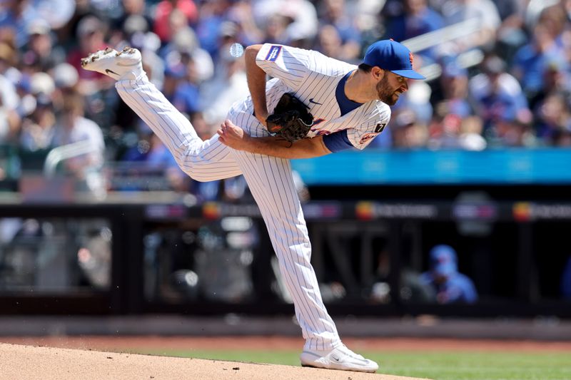 Apr 23, 2025; New York City, New York, USA; New York Mets starting pitcher David Peterson (23) follows through on a pitch against the Philadelphia Phillies during the first inning at Citi Field. Mandatory Credit: Brad Penner-Imagn Images