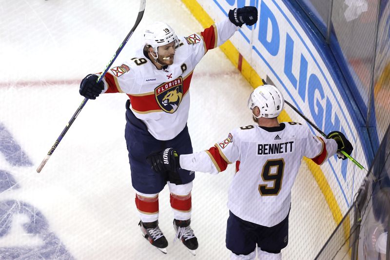 May 30, 2024; New York, New York, USA; Florida Panthers center Sam Bennett (9) celebrates his empty net goal against the New York Rangers with left wing Matthew Tkachuk (19) during the third period of game five of the Eastern Conference Final of the 2024 Stanley Cup Playoffs at Madison Square Garden. Mandatory Credit: Brad Penner-USA TODAY Sports