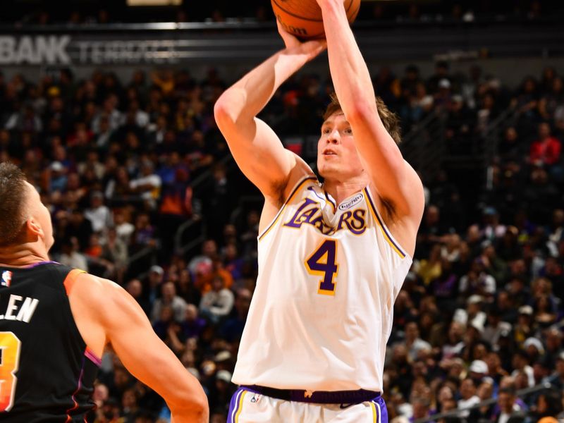 PHOENIX, AZ - NOVEMBER 26: Dalton Knecht #4 of the Los Angeles Lakers shoots the ball during the game against the Phoenix Suns during the Emirates NBA Cup game on November 26, 2024 at Footprint Center in Phoenix, Arizona. NOTE TO USER: User expressly acknowledges and agrees that, by downloading and or using this photograph, user is consenting to the terms and conditions of the Getty Images License Agreement. Mandatory Copyright Notice: Copyright 2024 NBAE (Photo by Barry Gossage/NBAE via Getty Images)