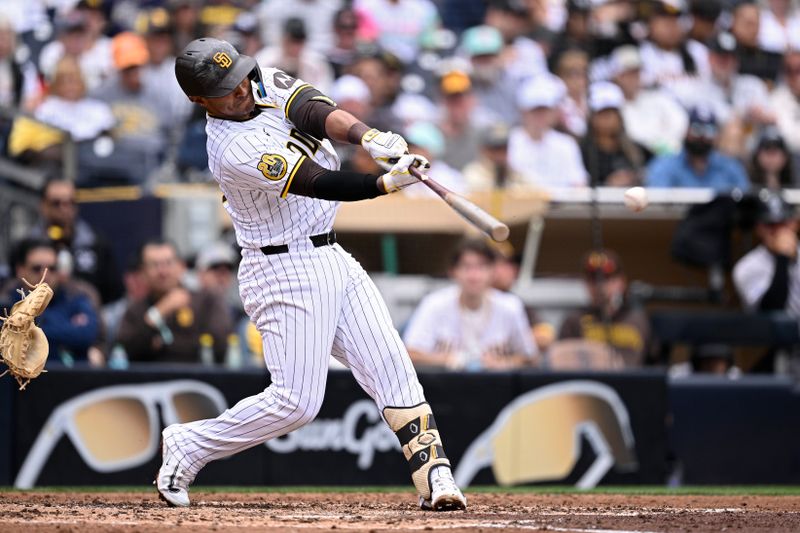 May 15, 2024; San Diego, California, USA; San Diego Padres third baseman Donovan Solano (39) hits a single against the Colorado Rockies during the fifth inning at Petco Park. Mandatory Credit: Orlando Ramirez-USA TODAY Sports