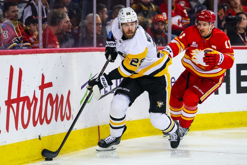 Jan 21, 2026; Calgary, Alberta, CAN; Pittsburgh Penguins defenseman Parker Wotherspoon (28) controls the puck against Calgary Flames center Mikael Backlund (11) during the second period at Scotiabank Saddledome. Mandatory Credit: Sergei Belski-Imagn Images