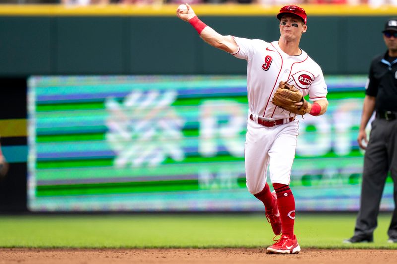 Aug 9, 2023; Cincinnati, OH, USA; Cincinnati Reds second baseman Matt McLain (9) throws out Miami Marlins left fielder Bryan De La Cruz (14) in the fourth inning of the MLB baseball game between Cincinnati Reds and Miami Marlins at Great American Ball Park in Cincinnati on Wednesday, Aug. 9, 2023.  Mandatory Credit: Albert Cesare-USA TODAY Sports