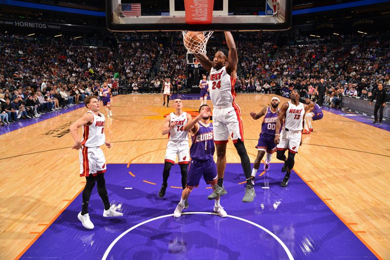 PHOENIX, AZ - NOVEMBER 6: Haywood Highsmith #24 of the Miami Heat dunks the ball during the game against the Phoenix Suns on November 6, 2024 at Footprint Center in Phoenix, Arizona. NOTE TO USER: User expressly acknowledges and agrees that, by downloading and or using this photograph, user is consenting to the terms and conditions of the Getty Images License Agreement. Mandatory Copyright Notice: Copyright 2024 NBAE (Photo by Barry Gossage/NBAE via Getty Images)