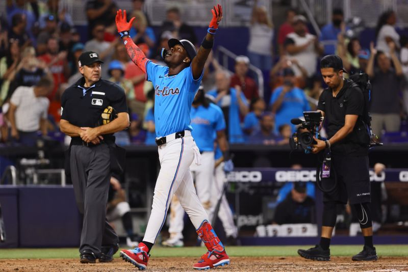 Jul 21, 2024; Miami, Florida, USA; Miami Marlins designated hitter Jazz Chisholm Jr. (2) celebrates as he scores after hitting a three-run home run against the New York Mets during the fourth inning at loanDepot Park. Mandatory Credit: Sam Navarro-USA TODAY Sports