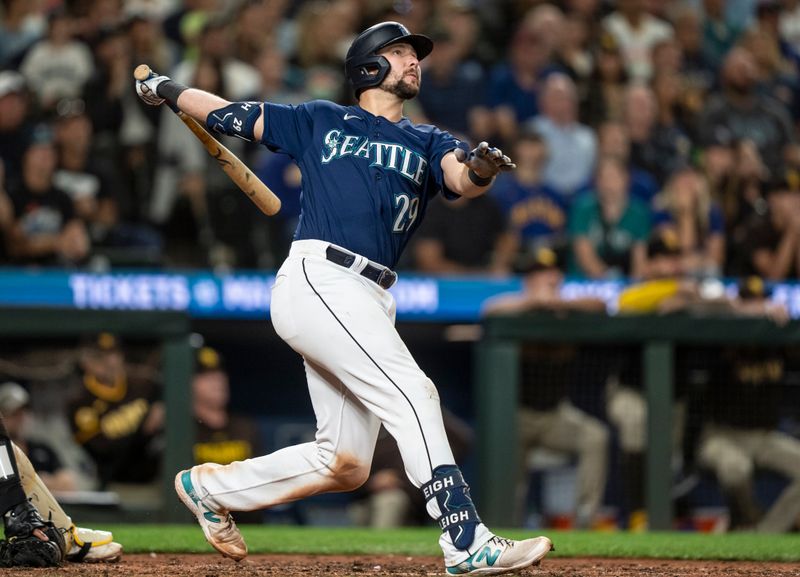 Aug 9, 2023; Seattle, Washington, USA; Seattle Mariners catcher Cal Raleigh (29) hits a two run home run during the eighth inning against the San Diego Padres at T-Mobile Park. Mandatory Credit: Stephen Brashear-USA TODAY Sports