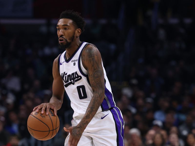 LOS ANGELES, CALIFORNIA - DECEMBER 12: Malik Monk #0 of the Sacramento Kings dribbles during a 119-99 loss to the LA Clippers at Crypto.com Arena on December 12, 2023 in Los Angeles, California.  NOTE TO USER: User expressly acknowledges and agrees that, by downloading and or using this photograph, User is consenting to the terms and conditions of the Getty Images License Agreement. (Photo by Harry How/Getty Images)