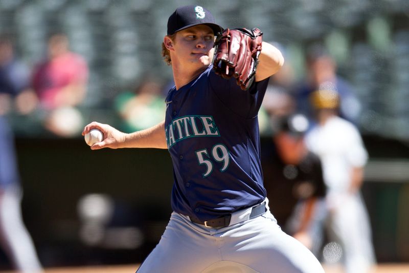 Sep 5, 2024; Oakland, California, USA; Seattle Mariners pitcher Troy Taylor (59) delivers a pitch against the Oakland Athletics during the sixth inning at Oakland-Alameda County Coliseum. Mandatory Credit: D. Ross Cameron-Imagn Images