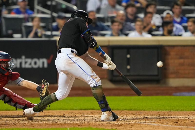 May 21, 2023; New York City, New York, USA; New York Mets second baseman Jeff McNeil (1) hits a sacrifice fly ball to drive in a run against the Cleveland Guardians during the eighth inning at Citi Field. Mandatory Credit: Gregory Fisher-USA TODAY Sports