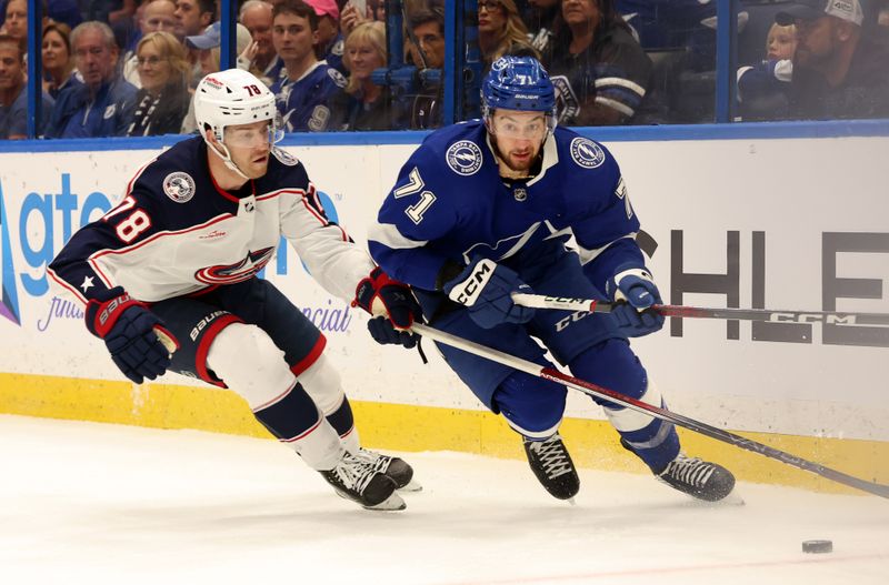 Apr 9, 2024; Tampa, Florida, USA; Tampa Bay Lightning center Anthony Cirelli (71) skates with the puck as Columbus Blue Jackets defenseman Damon Severson (78) defends during the first period at Amalie Arena. Mandatory Credit: Kim Klement Neitzel-USA TODAY Sports