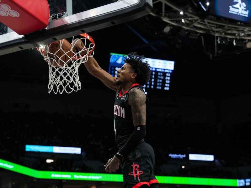 MINNEAPOLIS, MN -  FEBRUARY 4: Jalen Green #4 of the Houston Rockets dunks the ball during the game against the Minnesota Timberwolves on February 4, 2024 at Target Center in Minneapolis, Minnesota. NOTE TO USER: User expressly acknowledges and agrees that, by downloading and or using this Photograph, user is consenting to the terms and conditions of the Getty Images License Agreement. Mandatory Copyright Notice: Copyright 2024 NBAE (Photo by Jordan Johnson/NBAE via Getty Images)