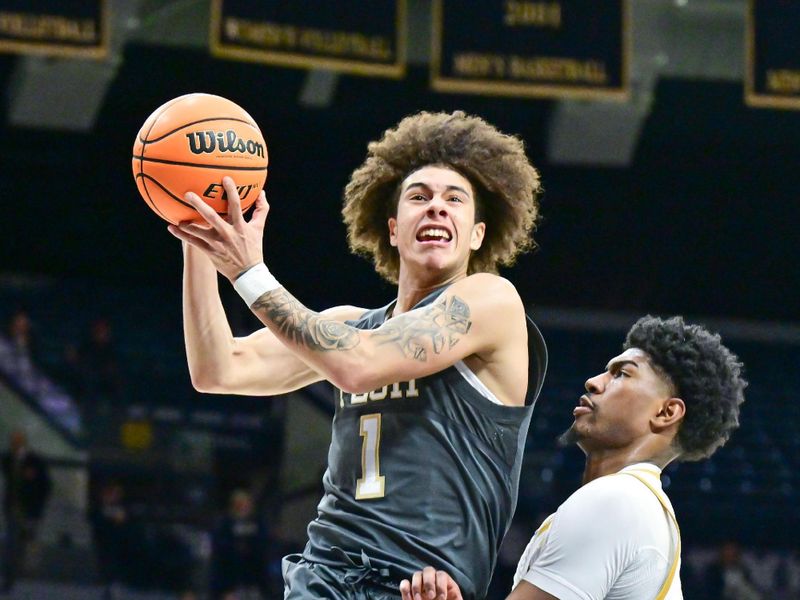 Jan 28, 2025; South Bend, Indiana, USA; Georgia Tech Yellow Jackets guard Naithan George (1) goes up for a shot as Notre Dame Fighting Irish forward Kebba Njie (14) defends in the second half at the Purcell Pavilion. Mandatory Credit: Matt Cashore-Imagn Images