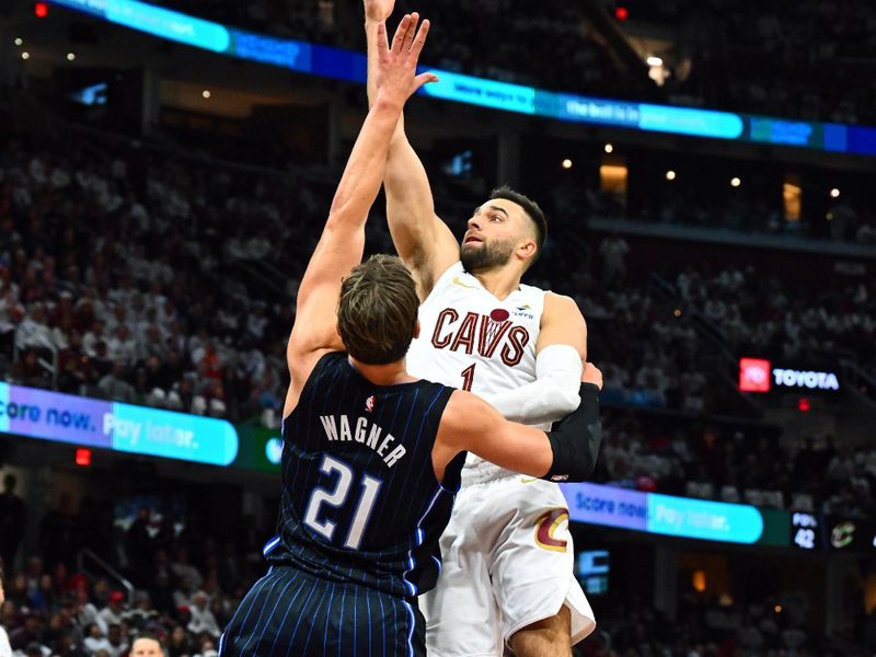 CLEVELAND, OHIO - APRIL 20: Max Strus #1 of the Cleveland Cavaliers shoots over Moritz Wagner #21 of the Orlando Magic during the fourth quarter of game one of the Eastern Conference First Round Playoffs at Rocket Mortgage Fieldhouse on April 20, 2024 in Cleveland, Ohio. The Cavaliers defeated the Magic 97-83. NOTE TO USER: User expressly acknowledges and agrees that, by downloading and or using this photograph, User is consenting to the terms and conditions of the Getty Images License Agreement. (Photo by Jason Miller/Getty Images)