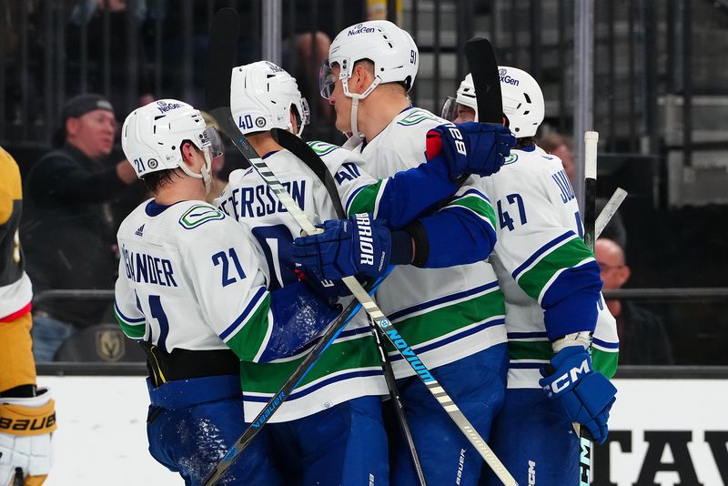 Mar 7, 2024; Las Vegas, Nevada, USA; Vancouver Canucks left wing Phillip Di Giuseppe (34) celebrates with team mates after scoring a goal against the Vegas Golden Knights during the first period at T-Mobile Arena. Mandatory Credit: Stephen R. Sylvanie-USA TODAY Sports