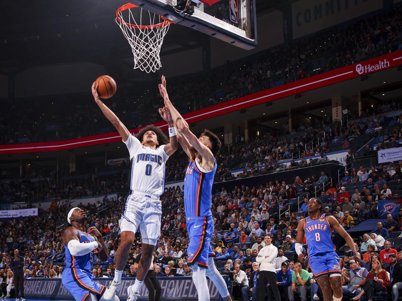 OKLAHOMA CITY, OK - NOVEMBER 4:  Anthony Black #0 of the Orlando Magic shoots the ball during the game against the Oklahoma City Thunder on November 4, 2024 at Paycom Center in Oklahoma City, Oklahoma. NOTE TO USER: User expressly acknowledges and agrees that, by downloading and or using this photograph, User is consenting to the terms and conditions of the Getty Images License Agreement. Mandatory Copyright Notice: Copyright 2024 NBAE (Photo by Zach Beeker/NBAE via Getty Images)