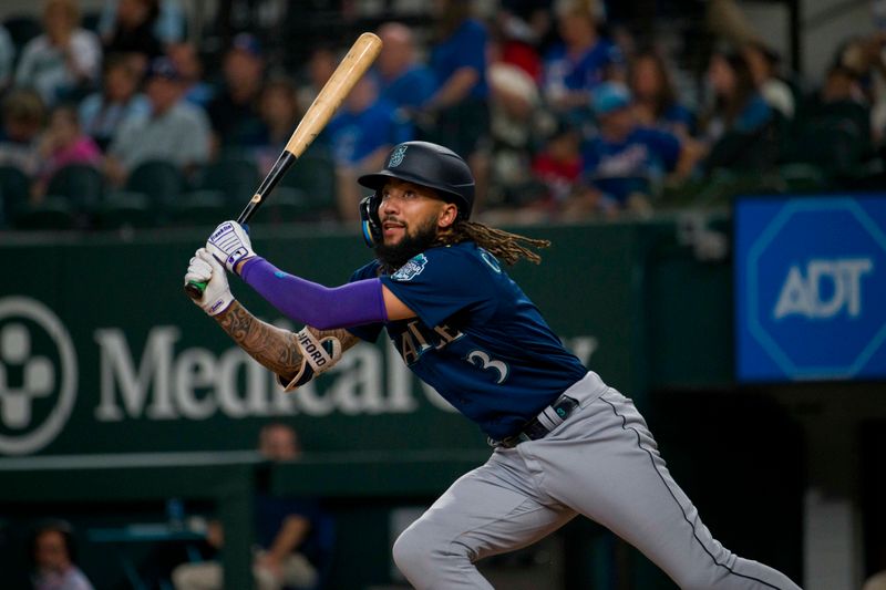 Sep 22, 2023; Arlington, Texas, USA; Seattle Mariners shortstop J.P. Crawford (3) bats against the Texas Rangers during the game at Globe Life Field. Mandatory Credit: Jerome Miron-USA TODAY Sports