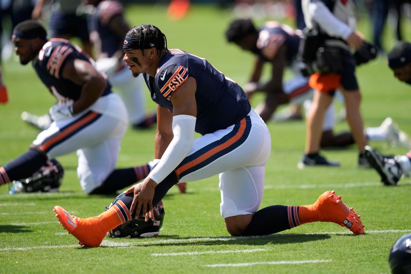 Chicago Bears quarterback Justin Fields warms up in an NFL preseason football game against the Tennessee Titans Saturday, August 12, 2023, in Chicago. (AP Photo/Charles Rex Arbogast)