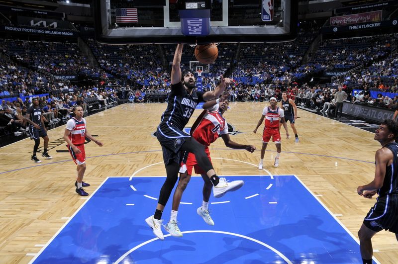 ORLANDO, FL - NOVMEBER 10: Goga Bitadze #35 of the Orlando Magic dunks the ball during the game against the Washington Wizards on November 10, 2024 at Kia Center in Orlando, Florida. NOTE TO USER: User expressly acknowledges and agrees that, by downloading and or using this photograph, User is consenting to the terms and conditions of the Getty Images License Agreement. Mandatory Copyright Notice: Copyright 2024 NBAE (Photo by Fernando Medina/NBAE via Getty Images)