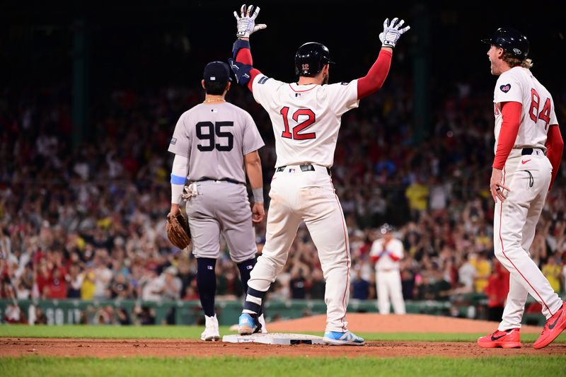 Jun 16, 2024; Boston, Massachusetts, USA; Boston Red Sox catcher Connor Wong (12) reacts after hitting an RBI double during the seventh inning against the New York Yankees at Fenway Park. Mandatory Credit: Eric Canha-USA TODAY Sports