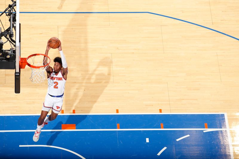 NEW YORK, NY - OCTOBER 4: Miles McBride #2 of the New York Knicks dunks the ball against the Detroit Pistons during a preseason game on October 4, 2022 at Madison Square Garden in New York City, New York.  NOTE TO USER: User expressly acknowledges and agrees that, by downloading and or using this photograph, User is consenting to the terms and conditions of the Getty Images License Agreement. Mandatory Copyright Notice: Copyright 2022 NBAE  (Photo by Nathaniel S. Butler/NBAE via Getty Images)