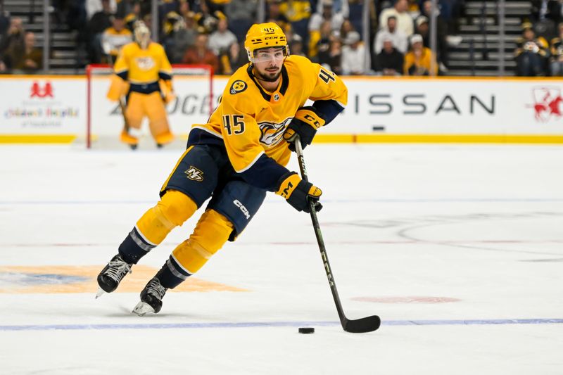 Oct 22, 2024; Nashville, Tennessee, USA; Nashville Predators defenseman Alexandre Carrier (45) skates with the puck against against the Boston Bruins during the third period at Bridgestone Arena. Mandatory Credit: Steve Roberts-Imagn Images