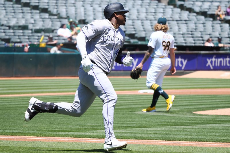 May 23, 2024; Oakland, California, USA; Colorado Rockies designated hitter Elehuris Montero (44) hits a double off of Oakland Athletics starting pitcher Joey Estes (68) during the first inning at Oakland-Alameda County Coliseum. Mandatory Credit: Kelley L Cox-USA TODAY Sports