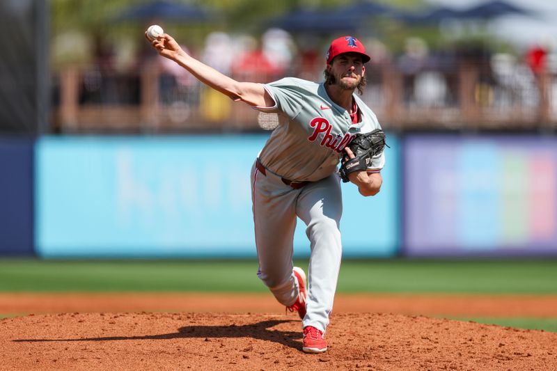 Mar 7, 2024; Port Charlotte, Florida, USA;  Philadelphia Phillies starting pitcher Aaron Nola (27) throws a pitch against the Tampa Bay Rays in the second inning at Charlotte Sports Park. Mandatory Credit: Nathan Ray Seebeck-USA TODAY Sports