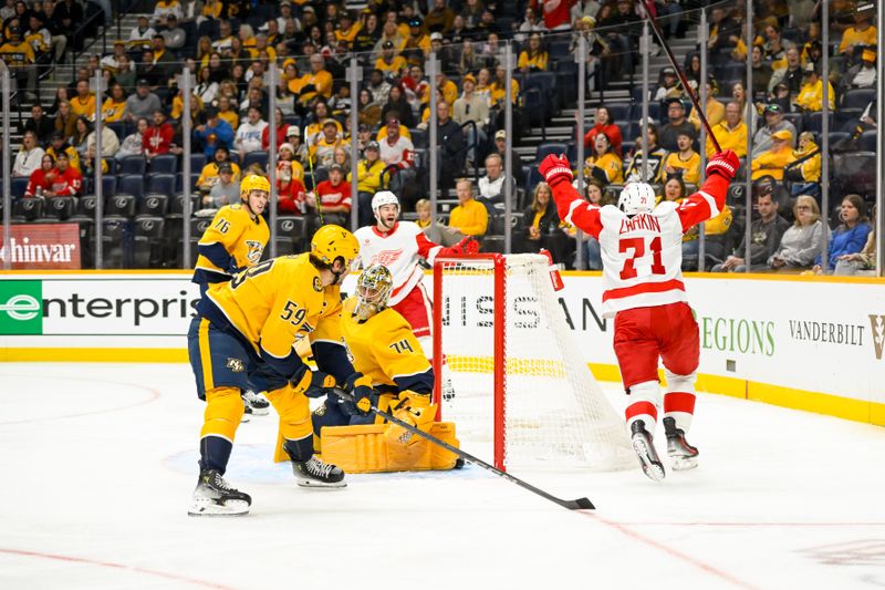 Oct 19, 2024; Nashville, Tennessee, USA; Detroit Red Wings center Dylan Larkin (71) celebrates his goal against the Nashville Predators during the second period at Bridgestone Arena. Mandatory Credit: Steve Roberts-Imagn Images