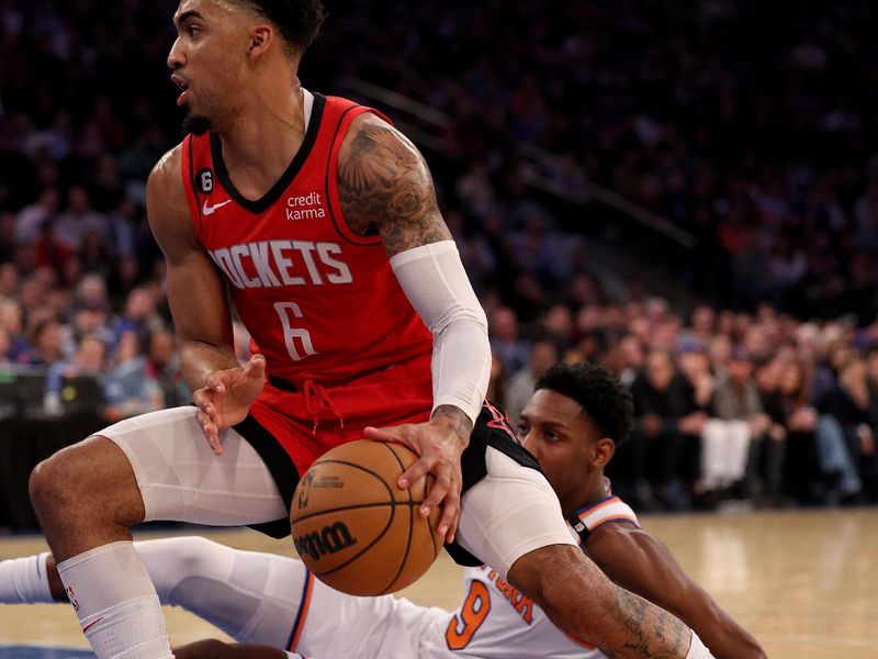 NEW YORK, NEW YORK - MARCH 27: Kenyon Martin Jr. #6 of the Houston Rockets heads for the net as RJ Barrett #9 of the New York Knicks defends during the first half at Madison Square Garden on March 27, 2023 in New York City. NOTE TO USER: User expressly acknowledges and agrees that, by downloading and or using this photograph, User is consenting to the terms and conditions of the Getty Images License Agreement. (Photo by Elsa/Getty Images)