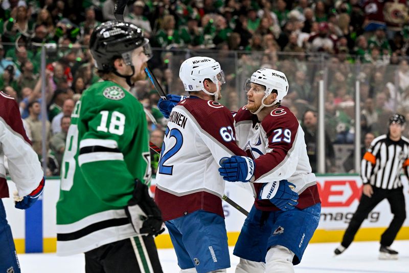 May 15, 2024; Dallas, Texas, USA; Colorado Avalanche left wing Artturi Lehkonen (62) and center Nathan MacKinnon (29) celebrates a power play goal scored by Lehkonen against the Dallas Stars during the first period in game five of the second round of the 2024 Stanley Cup Playoffs at American Airlines Center. Mandatory Credit: Jerome Miron-USA TODAY Sports