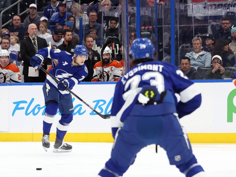Jan 16, 2025; Tampa, Florida, USA;Tampa Bay Lightning defenseman Emil Lilleberg (78) passes to center Michael Eyssimont (23) the puck against the Anaheim Ducks  during the first period at Amalie Arena. Mandatory Credit: Kim Klement Neitzel-Imagn Images