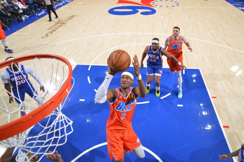 PHILADELPHIA, PA - JANUARY 14: Shai Gilgeous-Alexander #2 of the Oklahoma City Thunder drives to the basket during the game against the Philadelphia 76ers on January 14, 2025 at the Wells Fargo Center in Philadelphia, Pennsylvania NOTE TO USER: User expressly acknowledges and agrees that, by downloading and/or using this Photograph, user is consenting to the terms and conditions of the Getty Images License Agreement. Mandatory Copyright Notice: Copyright 2025 NBAE (Photo by Jesse D. Garrabrant/NBAE via Getty Images)