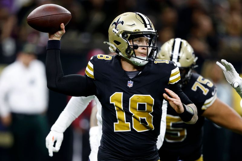 New Orleans Saints quarterback Spencer Rattler throws a pass during the second half of an NFL football game against the Denver Broncos, Thursday, Oct. 17, 2024, in New Orleans. (AP Photo/Butch Dill)