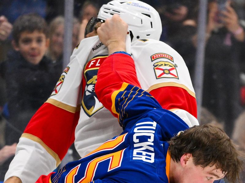Jan 29, 2026; St. Louis, Missouri, USA; St. Louis Blues defenseman Tyler Tucker (75) fights Florida Panthers left wing A.J. Greer (10) during the second period at Enterprise Center. Mandatory Credit: Jeff Curry-Imagn Images