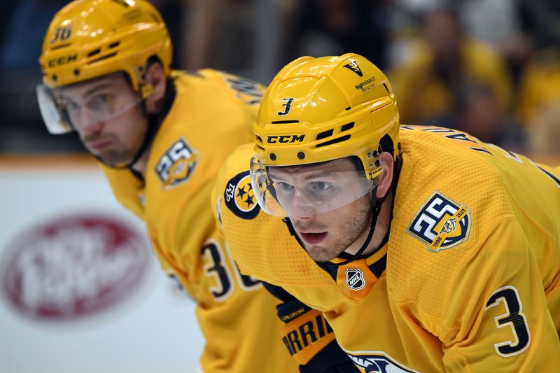 Mar 26, 2024; Nashville, Tennessee, USA; Nashville Predators defenseman Jeremy Lauzon (3) and left wing Cole Smith (36) wait for a face off during the second period against the Vegas Golden Knights at Bridgestone Arena. Mandatory Credit: Christopher Hanewinckel-USA TODAY Sports