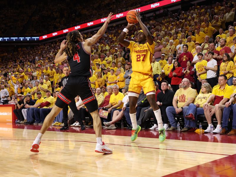 Feb 16, 2026; Ames, Iowa, USA; Iowa State Cyclonesh4 defends the shot from Iowa State Cyclones guard Killyan Toure (27) during the first half at James H. Hilton Coliseum. Mandatory Credit: Reese Strickland-Imagn Images