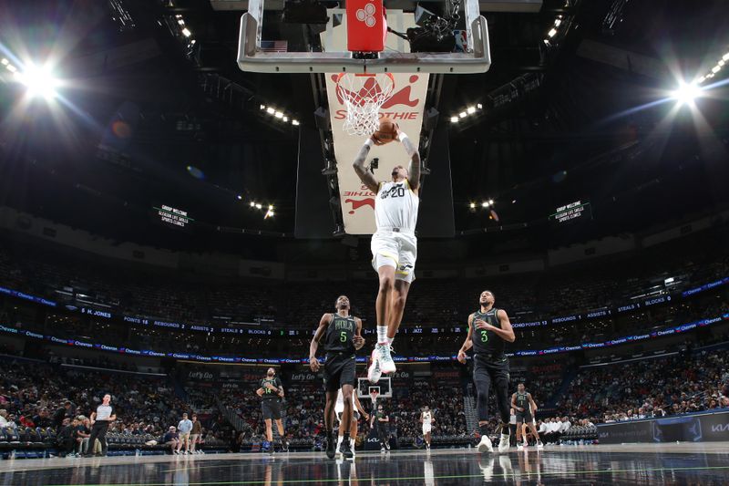 NEW ORLEANS, LA - JANUARY 23: John Collins #20 of the Utah Jazz drives to the basket during the game against the New Orleans Pelicans on January 23, 2024 at the Smoothie King Center in New Orleans, Louisiana. NOTE TO USER: User expressly acknowledges and agrees that, by downloading and or using this Photograph, user is consenting to the terms and conditions of the Getty Images License Agreement. Mandatory Copyright Notice: Copyright 2024 NBAE (Photo by Layne Murdoch Jr./NBAE via Getty Images)