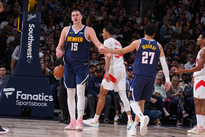 DENVER, CO - MARCH 11: Jamal Murray #27 and Nikola Jokic #15 of the Denver Nuggets look on during the game against the Toronto Raptors on March 11, 2024 at the Ball Arena in Denver, Colorado. NOTE TO USER: User expressly acknowledges and agrees that, by downloading and/or using this Photograph, user is consenting to the terms and conditions of the Getty Images License Agreement. Mandatory Copyright Notice: Copyright 2024 NBAE (Photo by Bart Young/NBAE via Getty Images)