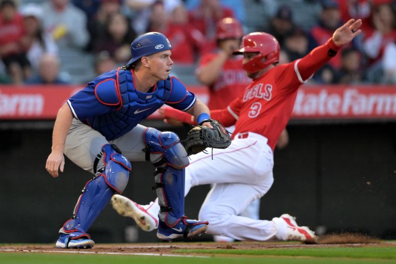 Mar 26, 2024; Anaheim, California, USA;  Los Angeles Angels shortstop Zach Neto (9) beats the throw to Los Angeles Dodgers catcher Will Smith (16) to score a run in the first inning at Angel Stadium. Mandatory Credit: Jayne Kamin-Oncea-USA TODAY Sports