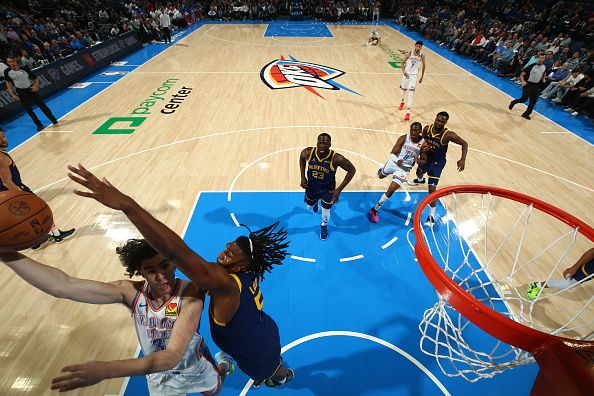 OKLAHOMA CITY, OK - DECEMBER 8: Josh Giddey #3 of the Oklahoma City Thunder drives to the basket during the game against the Golden State Warriors on December 8, 2023 at Paycom Arena in Oklahoma City, Oklahoma. NOTE TO USER: User expressly acknowledges and agrees that, by downloading and or using this photograph, User is consenting to the terms and conditions of the Getty Images License Agreement. Mandatory Copyright Notice: Copyright 2023 NBAE (Photo by Zach Beeker/NBAE via Getty Images)