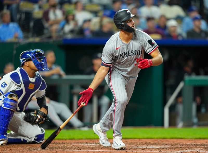Apr 9, 2025; Kansas City, Missouri, USA; Minnesota Twins designated hitter Matt Wallner (38) hits a home run during the eighth inning against the Kansas City Royals at Kauffman Stadium. Mandatory Credit: Jay Biggerstaff-Imagn Images