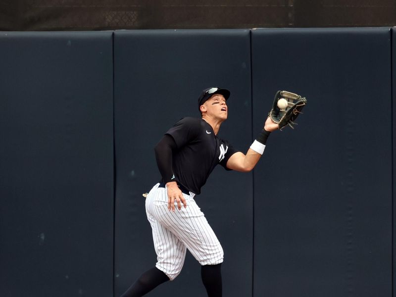 Mar 6, 2024; Tampa, Florida, USA;  New York Yankees right fielder Aaron Judge (99) catches a fly ball during the fifth inning against the Tampa Bay Rays at George M. Steinbrenner Field. Mandatory Credit: Kim Klement Neitzel-USA TODAY Sports