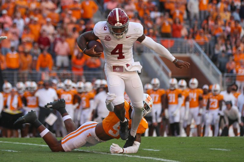 Oct 19, 2024; Knoxville, Tennessee, USA; Alabama Crimson Tide quarterback Jalen Milroe (4) is sacked by Tennessee Volunteers defensive back Jakobe Thomas (9) during the first quarter at Neyland Stadium. Mandatory Credit: Randy Sartin-Imagn Images
