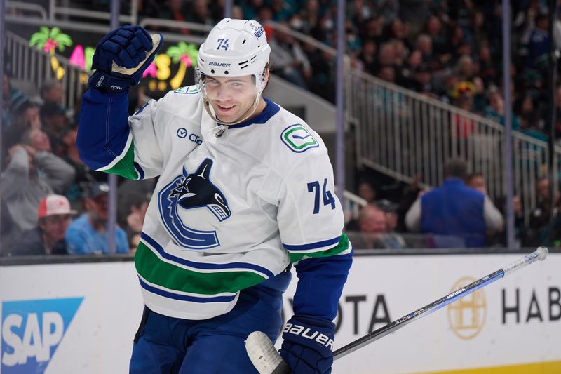 Nov 2, 2024; San Jose, California, USA; Vancouver Canucks left wing Jake DeBrusk (74) reacts after scoring a goal against the San Jose Sharks during the third period at SAP Center at San Jose. Mandatory Credit: Robert Edwards-Imagn Images